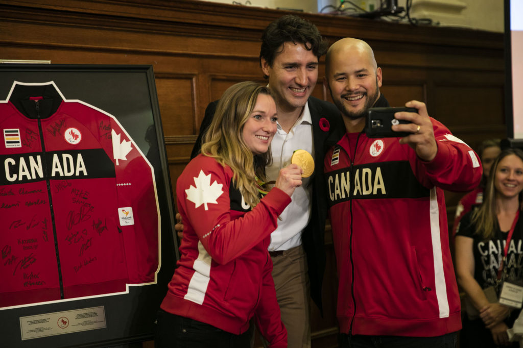 Canadian Olympic and Paralympic flag bearers present Prime Minister Justin Trudeau and the Minister of Sport Carla Qualtrough with a gift at Parliament Hill, Ottawa, Canada, Wednesday November 2, 2016. COC Photo/David Jackson